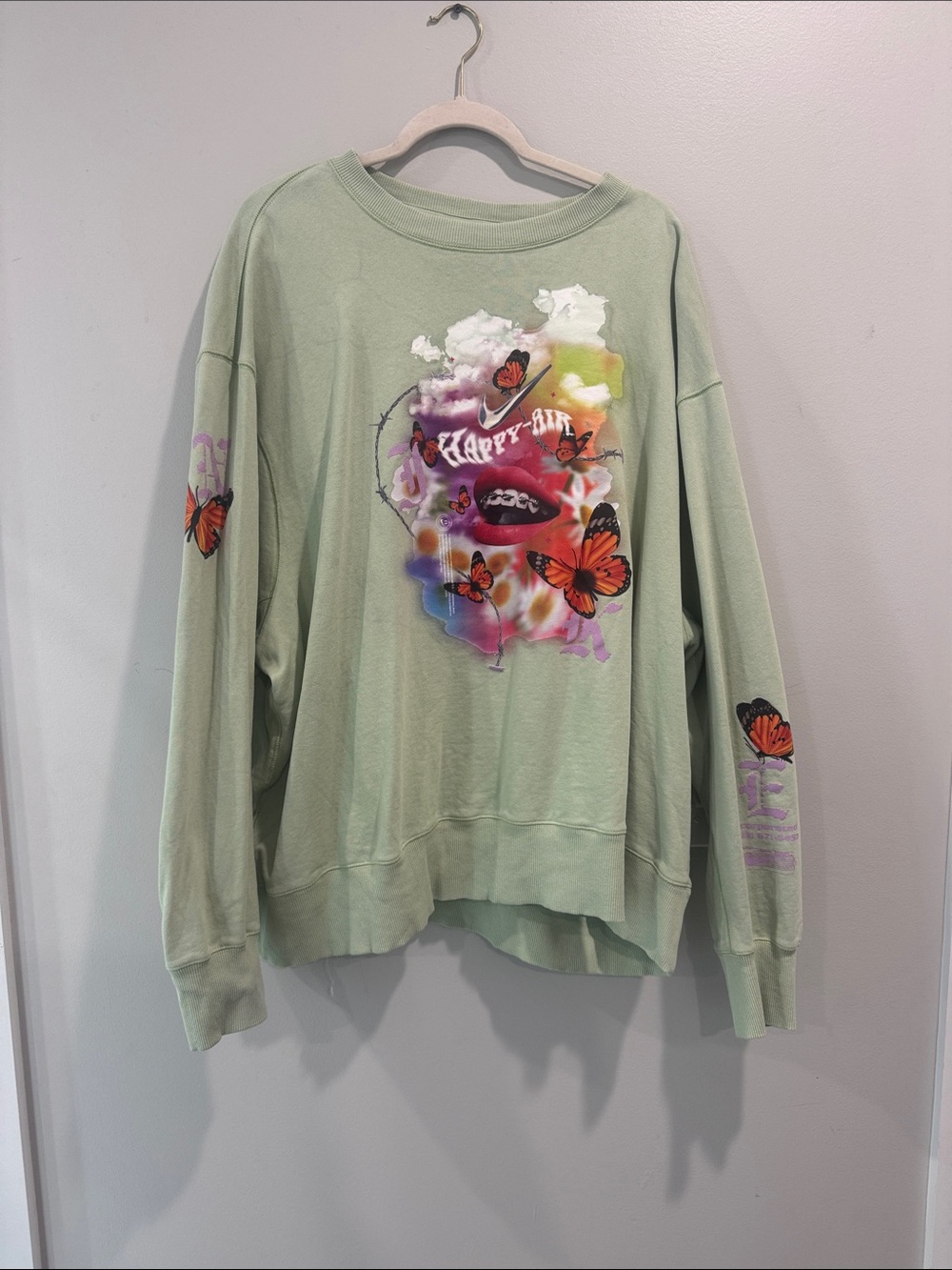 Nike Mint Green Sweatshirt with Multicolor Butterfly Graphic